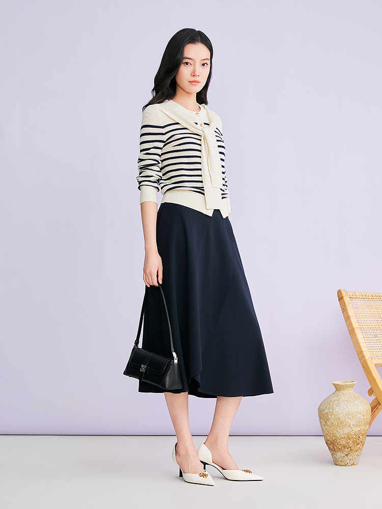 YINER音儿2026春季新款时尚莱赛尔羊毛混纺不规则波浪边A型半身裙8C36150330